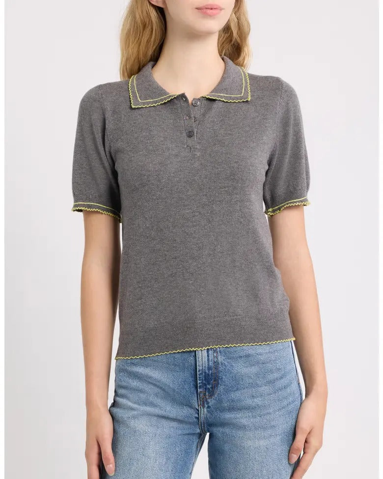 Springsteen short-sleeve knit polo in dark grey with yellow trim, front on model